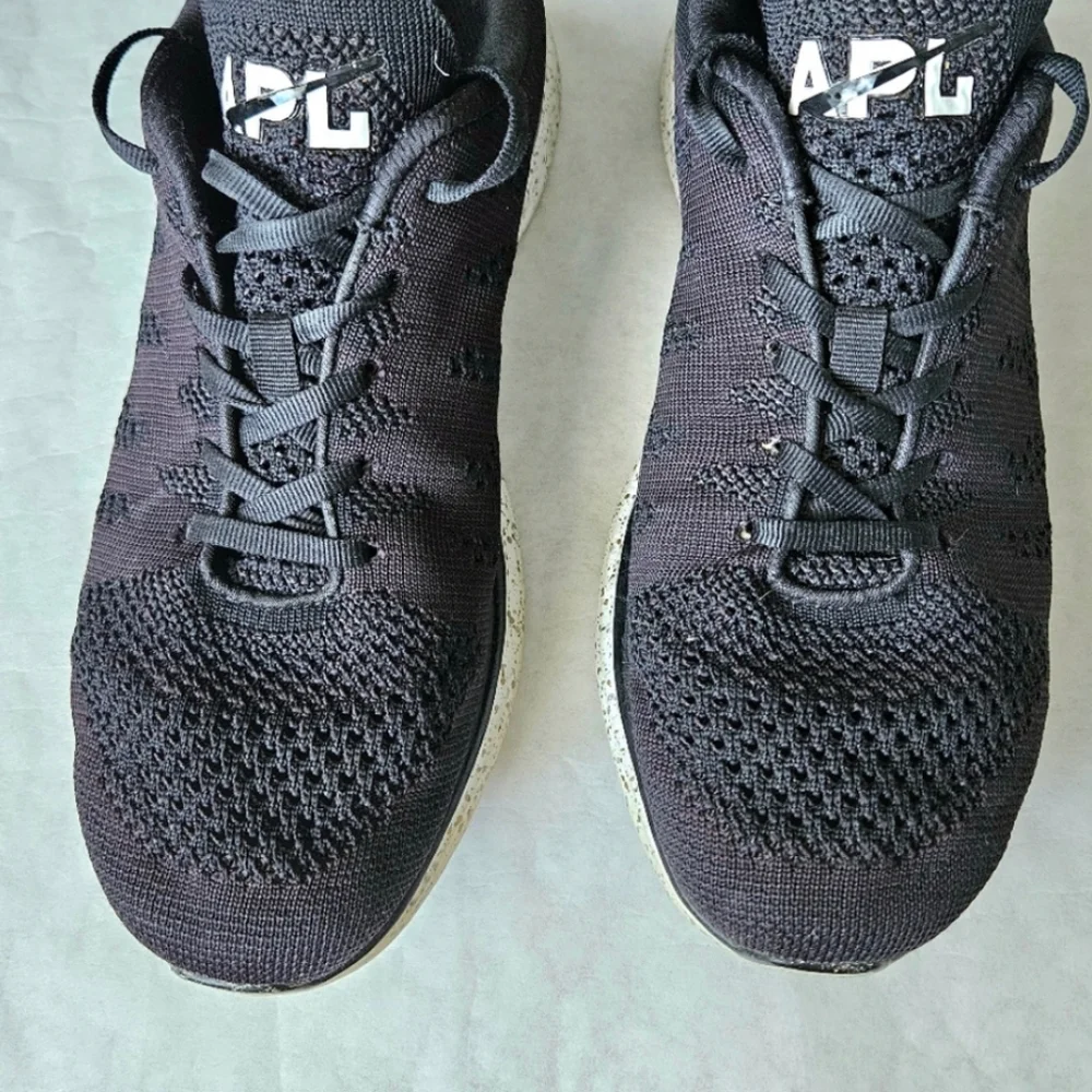 APL Techloom Pro black running shoes speckled soles